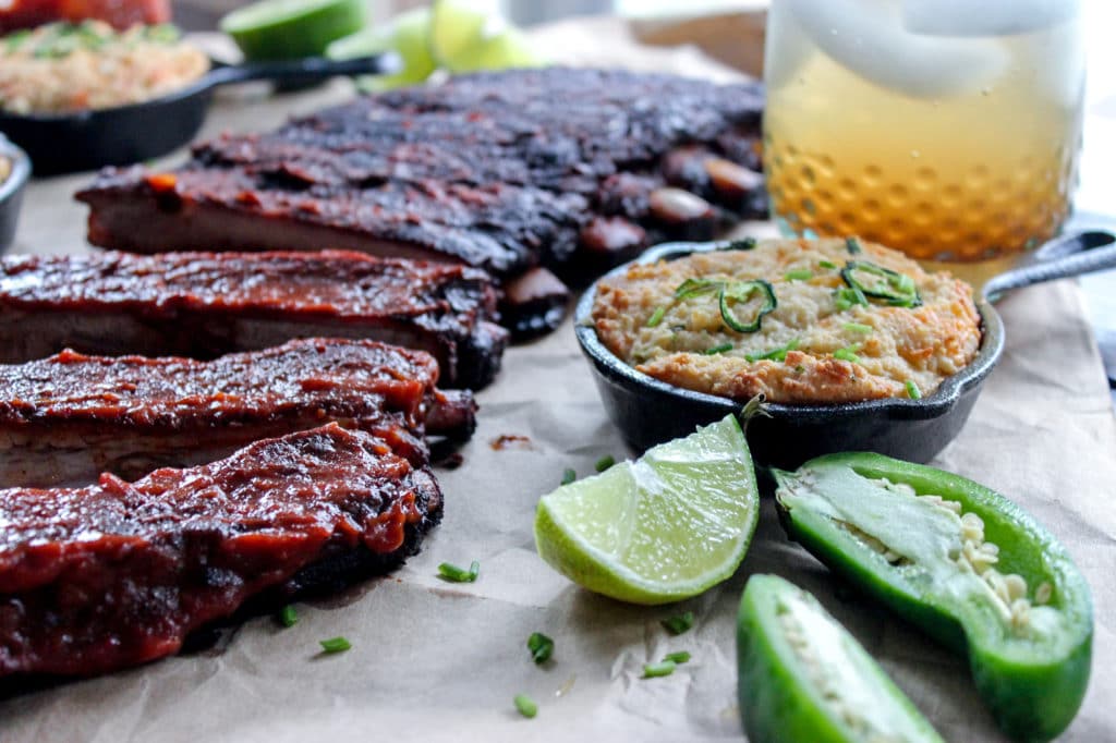A close up of a plate of ribs on a table.