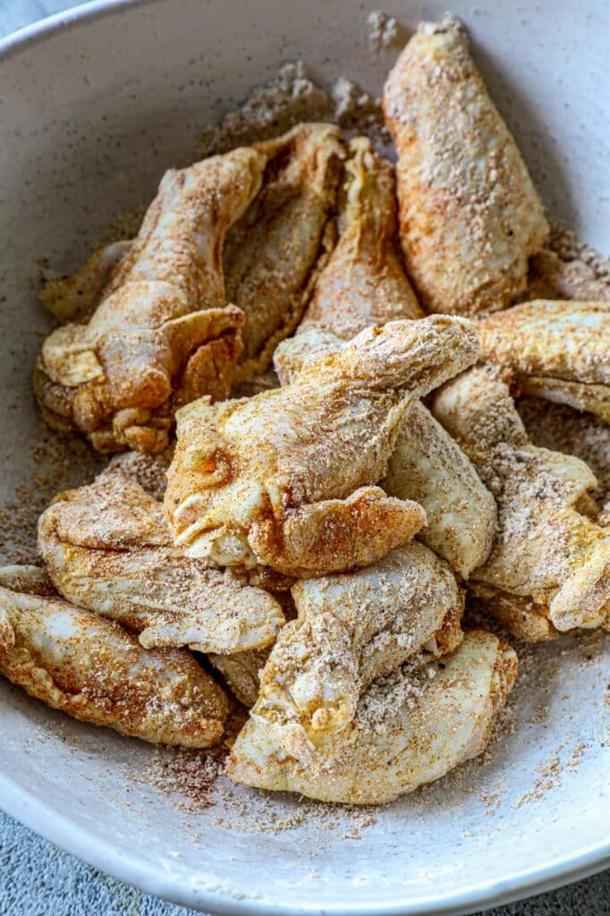 Adding the baking powder to the wings to get them crispy