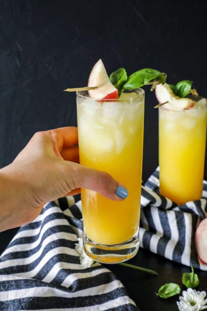 Low Carb Fuzzy Navel Cocktail held in a hand