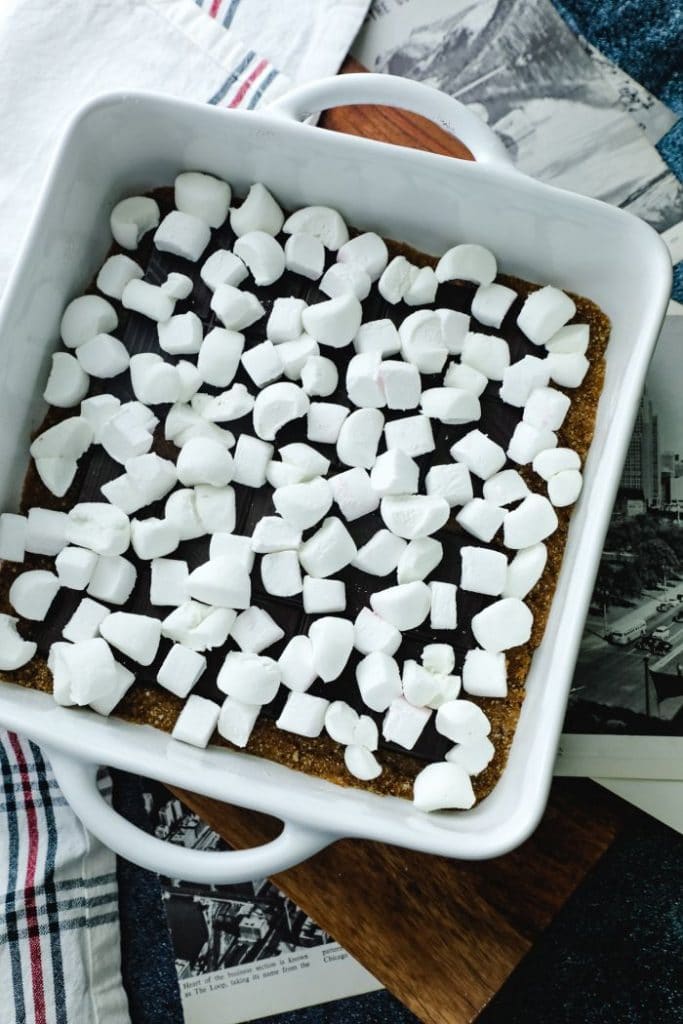 A 9x9 inch pan filled with all three layers of the smores bars, unbaked