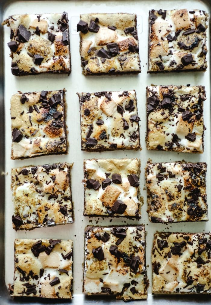 12 smores bars in rows on a baking sheet
