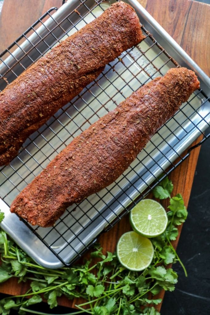Mole rubbed raw pork tenderloins
