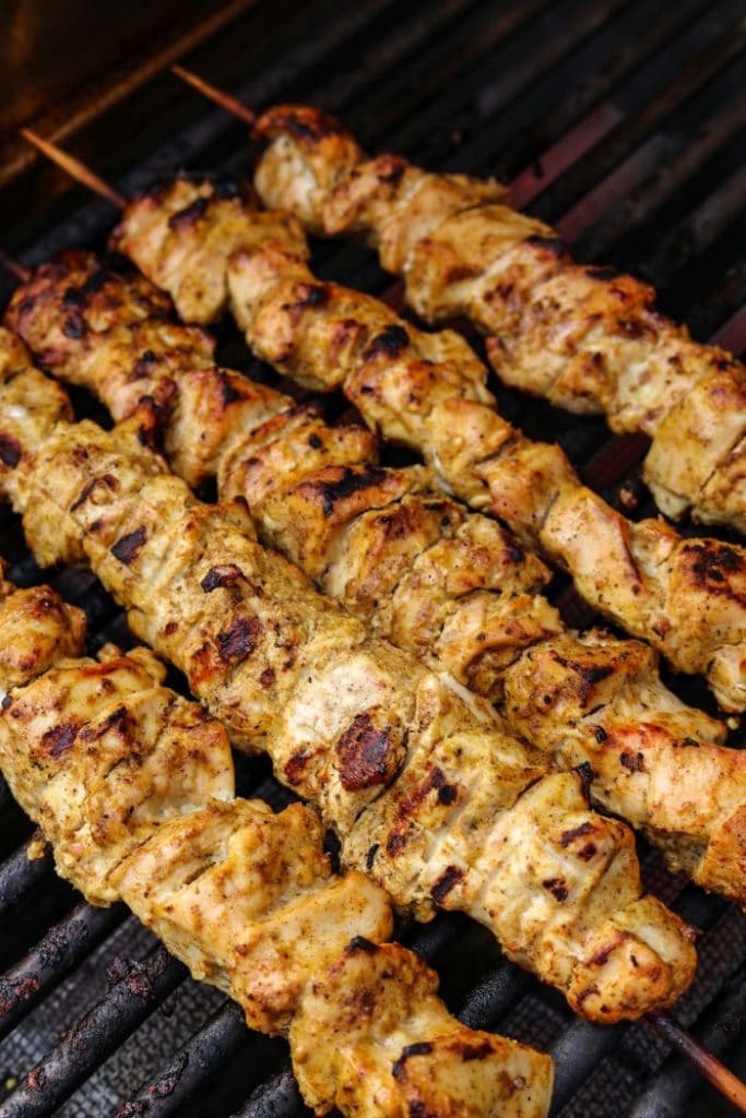 Chicken kebabs on the grill on direct heat.