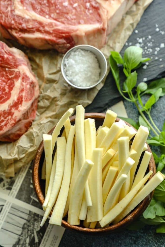 A bowl of sliced jicama for air frying.