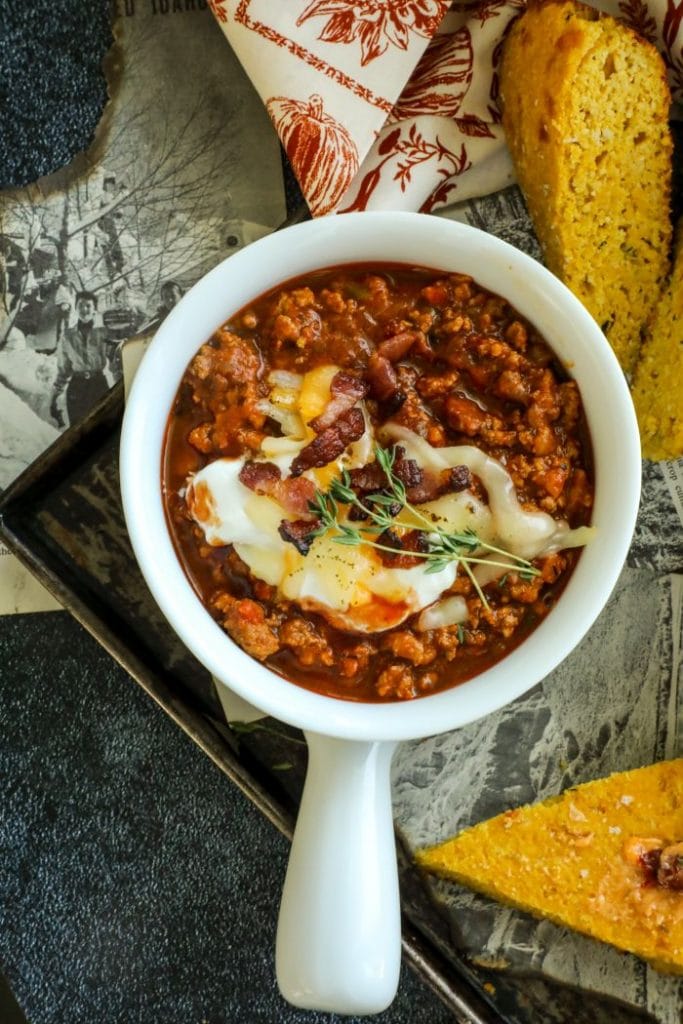 One white bowl filled with Low Carb Chipotle Pumpkin Turkey Chili