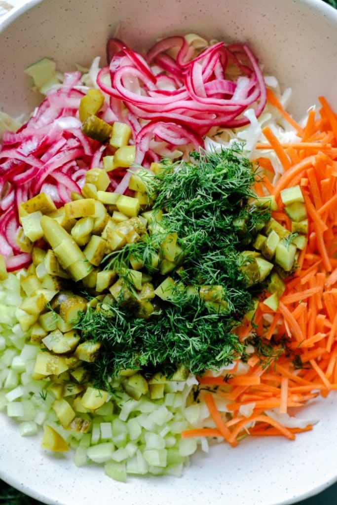Dill Pickle Coleslaw ingredients mixed in a bowl