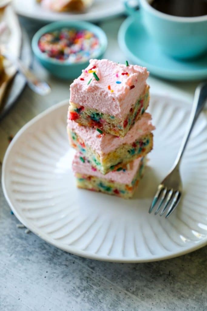 4 stacked cookie bars on a white plate