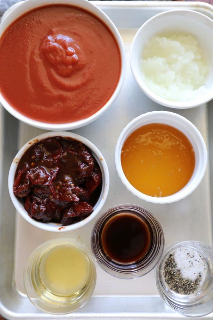 Homemade Honey Chipotle BBQ Sauce ingredients on a sheet pan