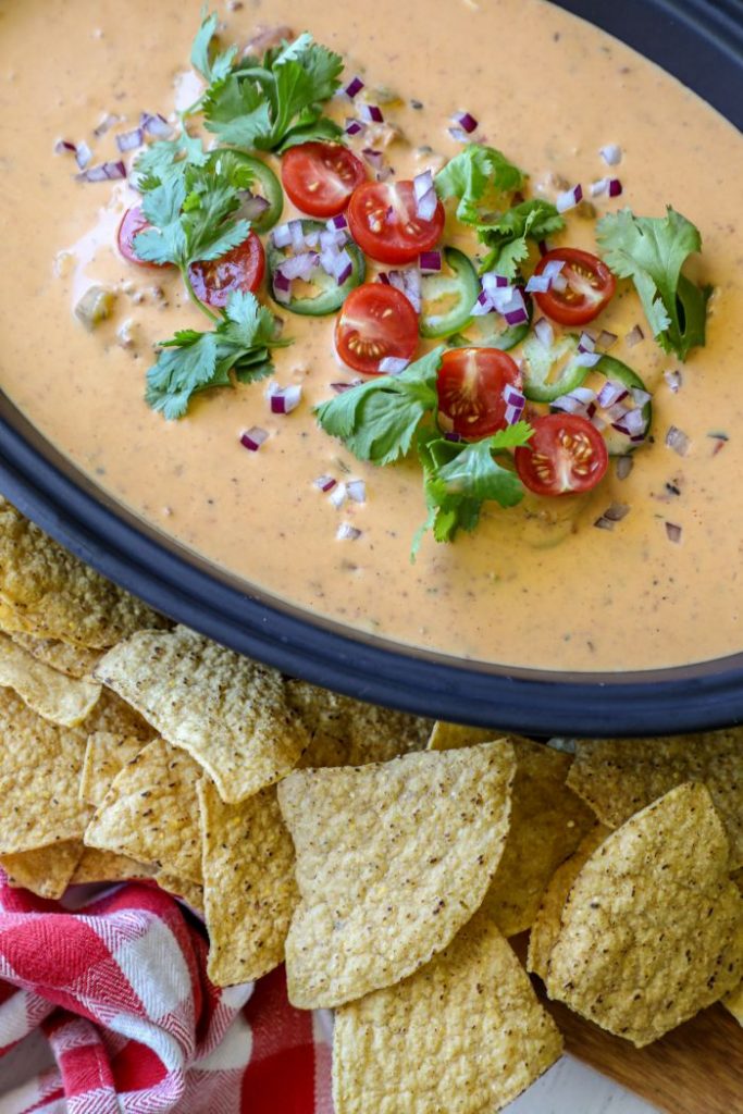 Smoked queso on a platter with tortilla chips