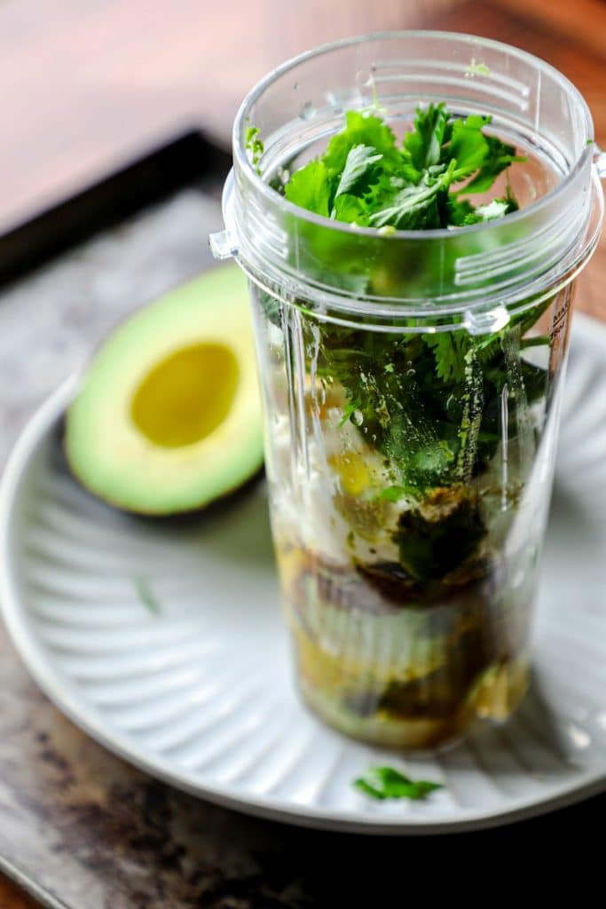 Avocado dressing ingredients in a small blender bottle