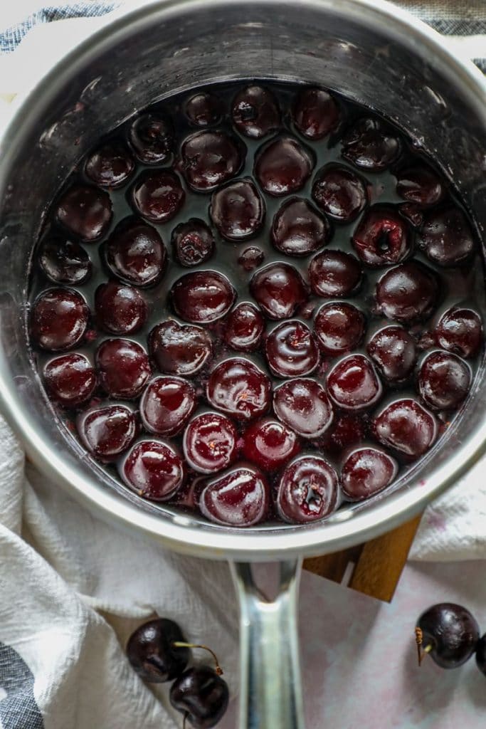 Cooked cherries in a pot