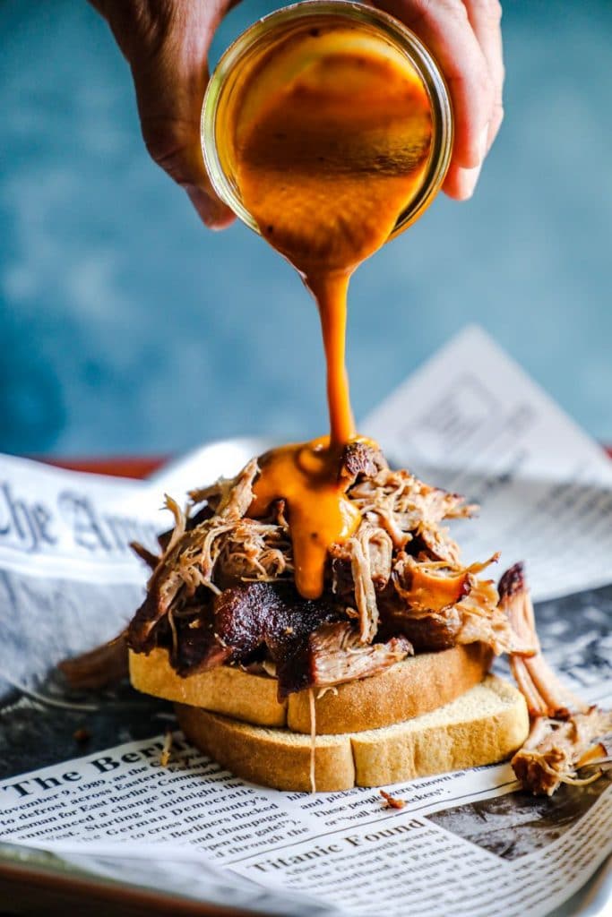 BBQ sauce poured onto pulled pork