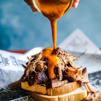 Mustard BBQ sauce poured over pulled pork