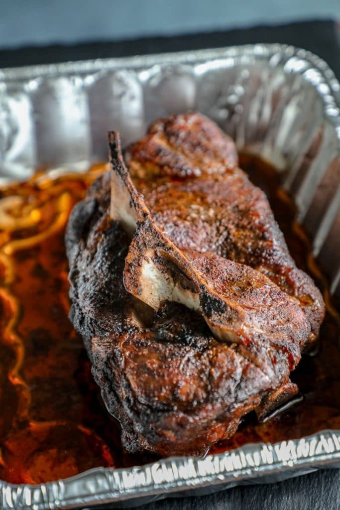 A pork butt roast smoked on a gas grill