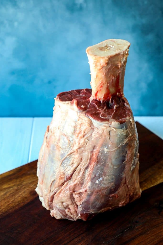 A frenched, raw beef shank