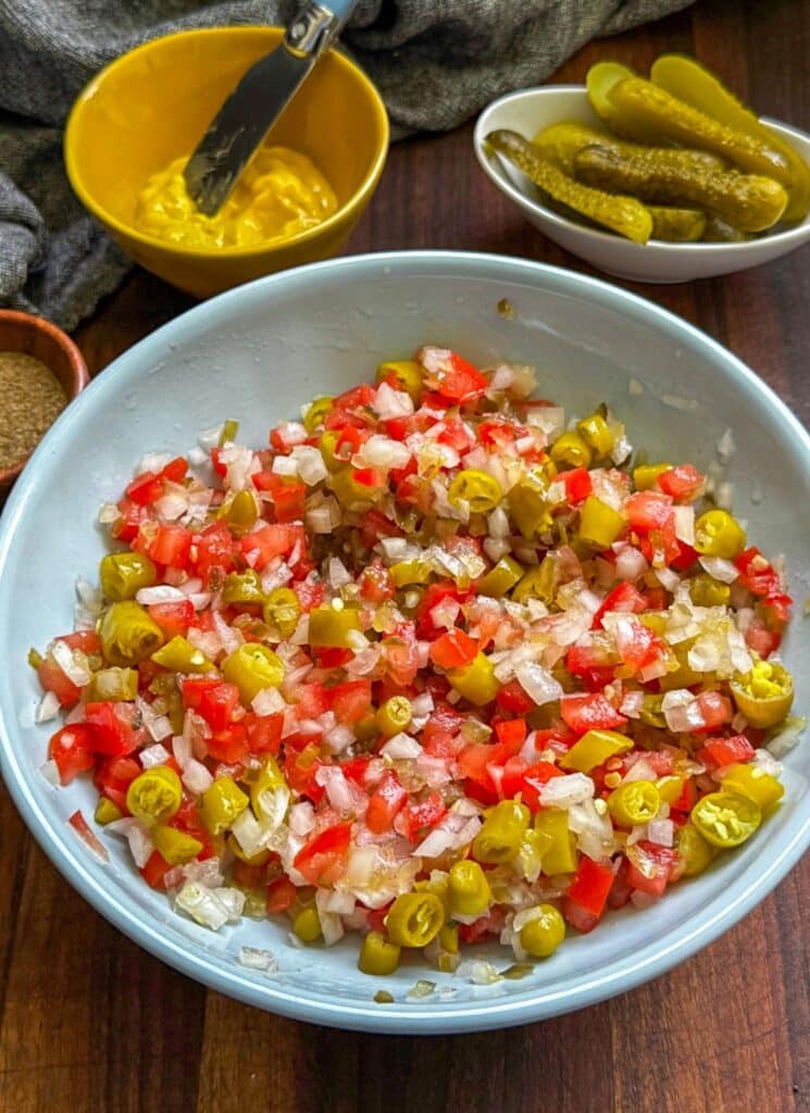 making the toppings for the chicago dogs