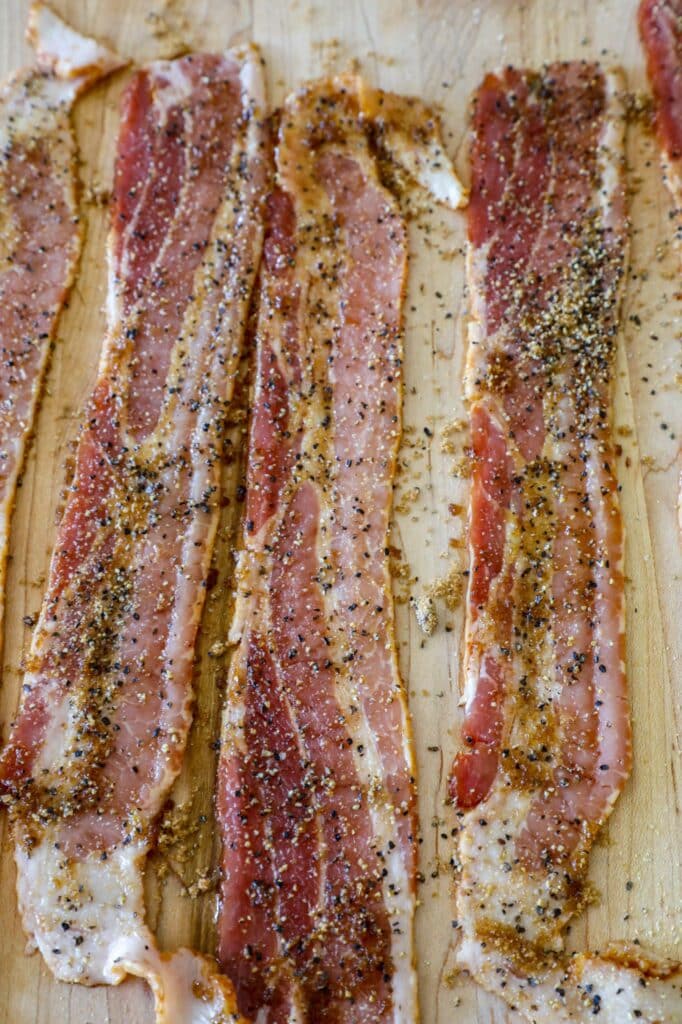 Season strips of bacon before slicing and topping the beans