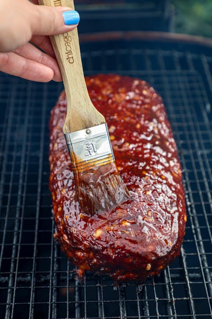 saucing the smoked meatloaf