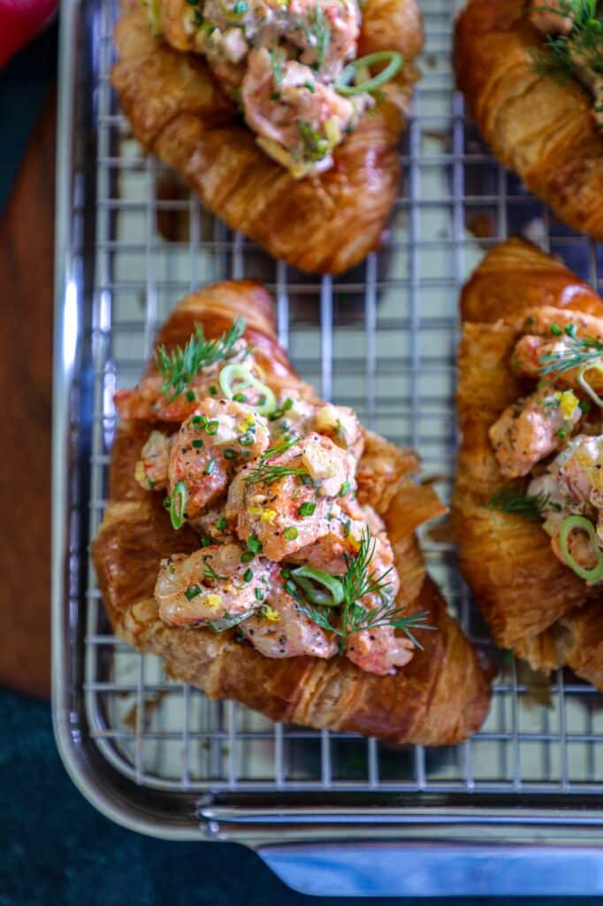 Grilled Shrimp Rolls placed on a baking sheet lined with a wire rack.