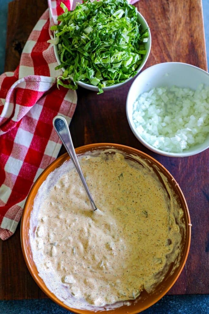 Big mac special sauce in a large bowl with a spoon.