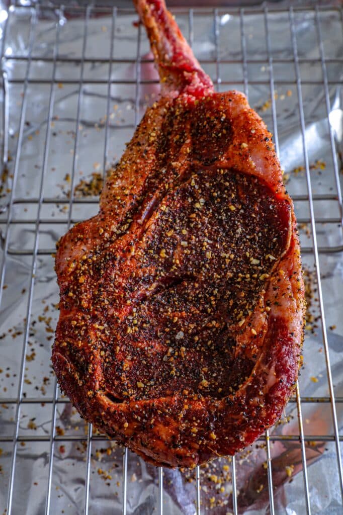 Seasoning a tomahawk steak