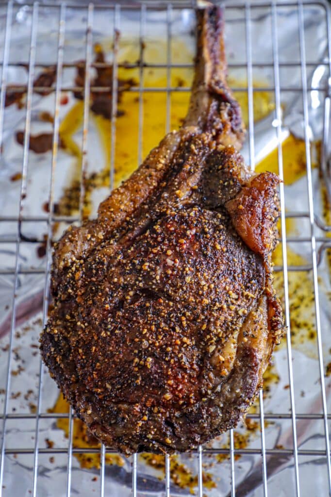 A tomahawk steak slow cooked in the oven to 120 F before reverse searing