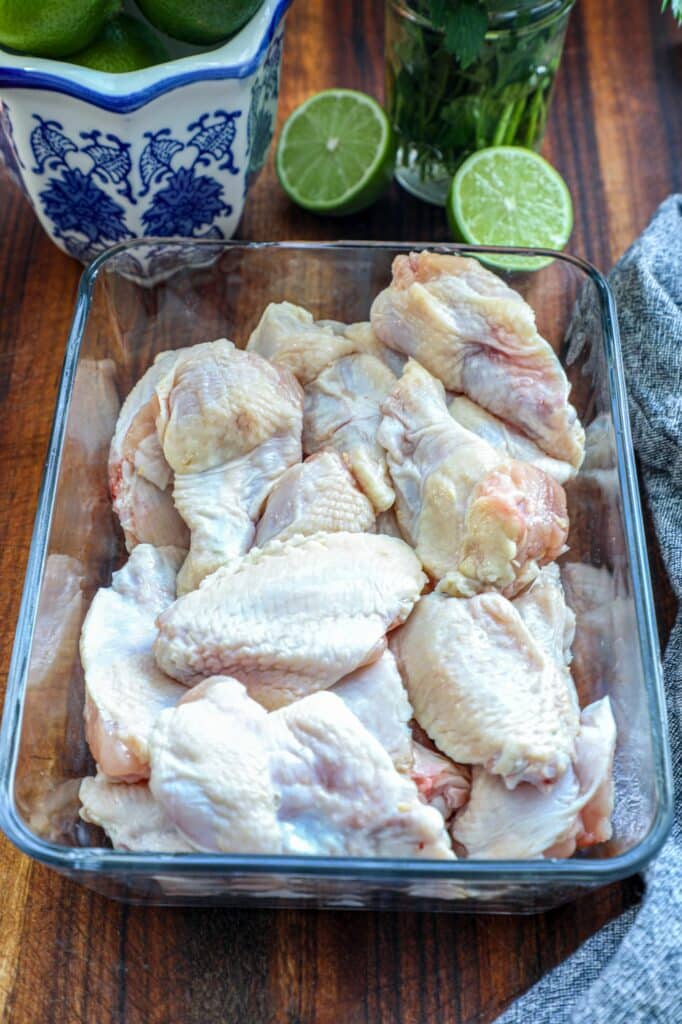 Raw chicken wings in a dish