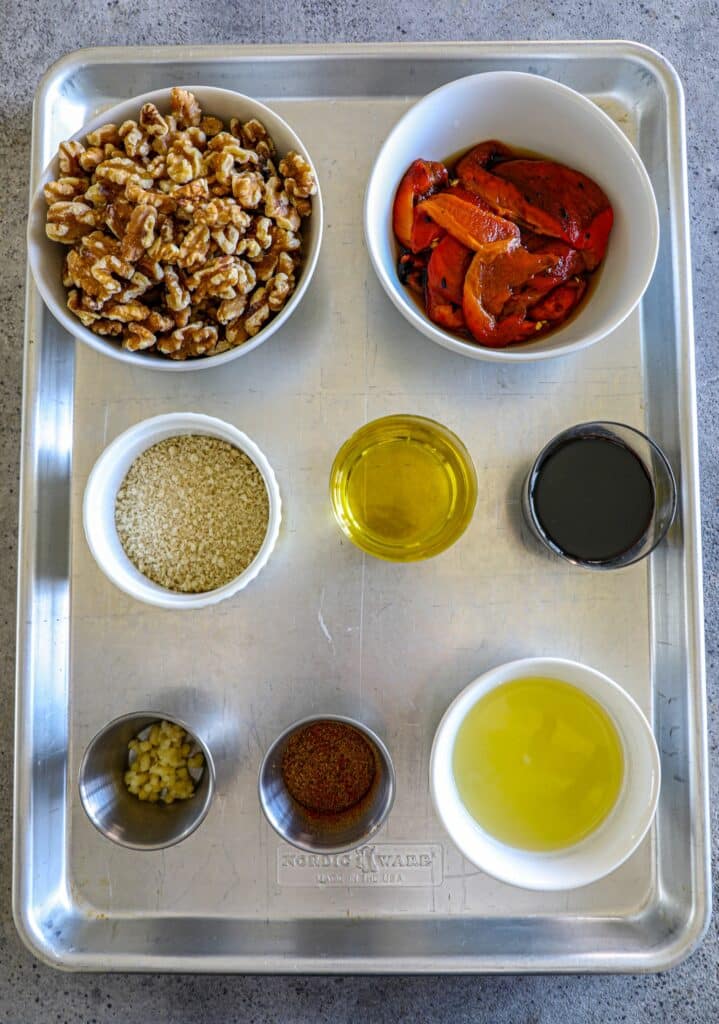 Muhummara Dip Recipe ingredients on a baking sheet