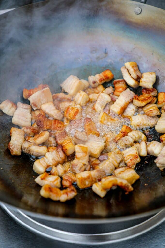 Crisping the pork belly in the wok