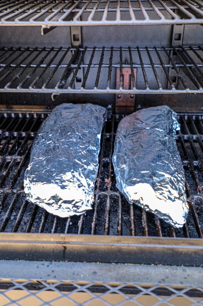 Wrapped bbq ribs on the smoker