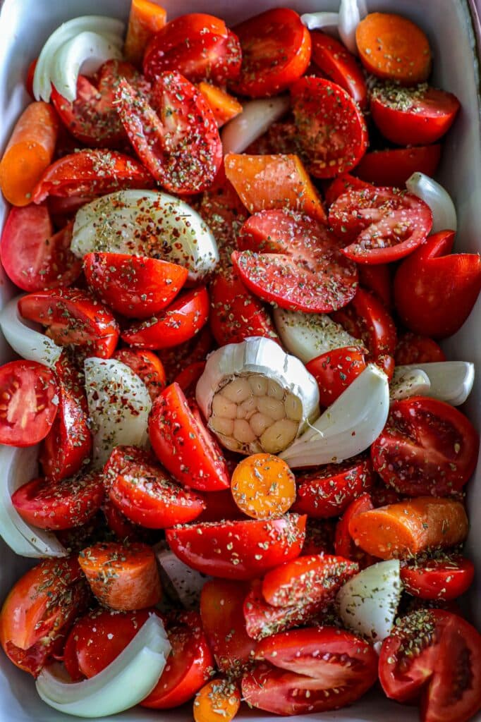Prepping the tomatoes and ingredients in the pan