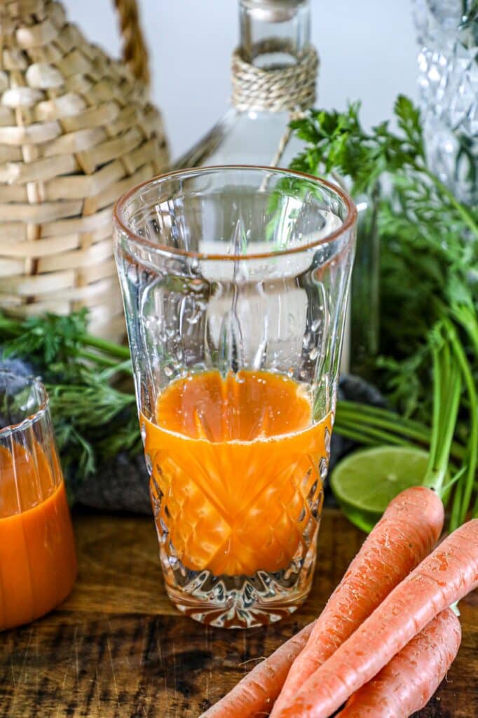 Carrot Margarita ingredients in a cocktail shaker