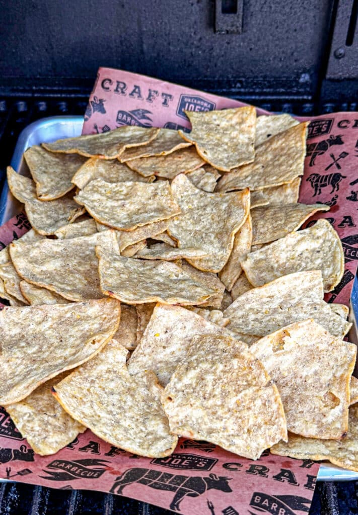 Warming the tortilla chips on the smoker