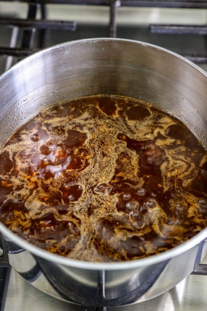 Making the huli huli sauce in a pot on the stove