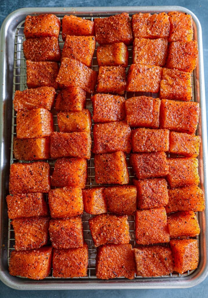 Salmon Burnt Ends sliced and seasoned on a wire rack