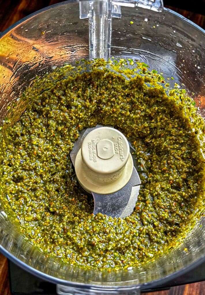 fully blended pistachio pesto inside the food processor bowl
