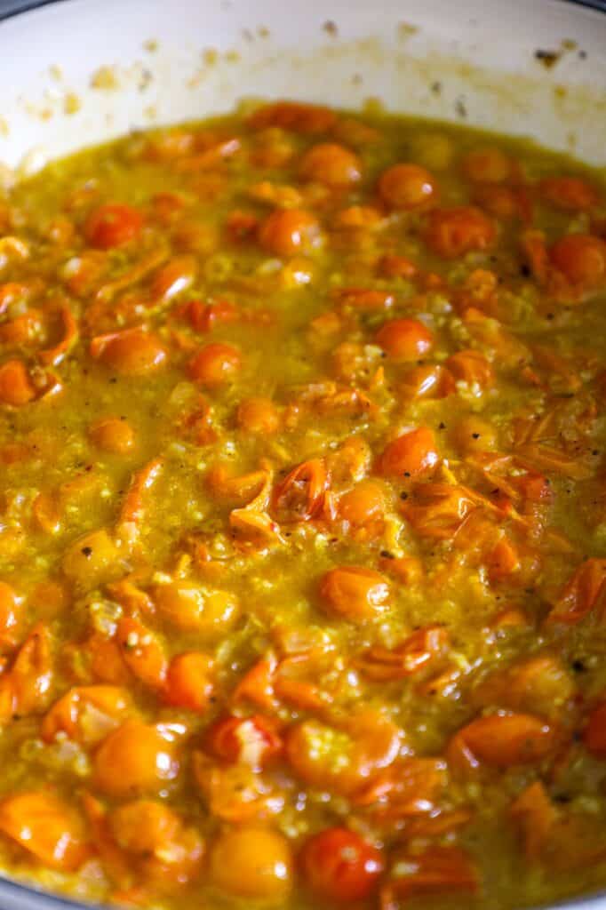 letting the tomatoes cook down and burst, adding the vodka