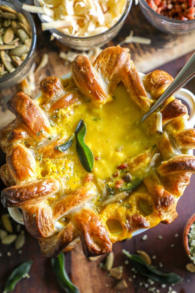 Roasted Butternut Squash Soup with a spoon in and soup coming out