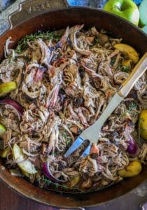 shredded apple cider pork in a large pan