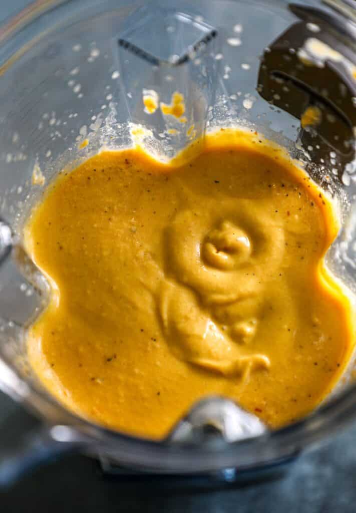 blending the roasted butternut squash with the sauce ingredients in the blender