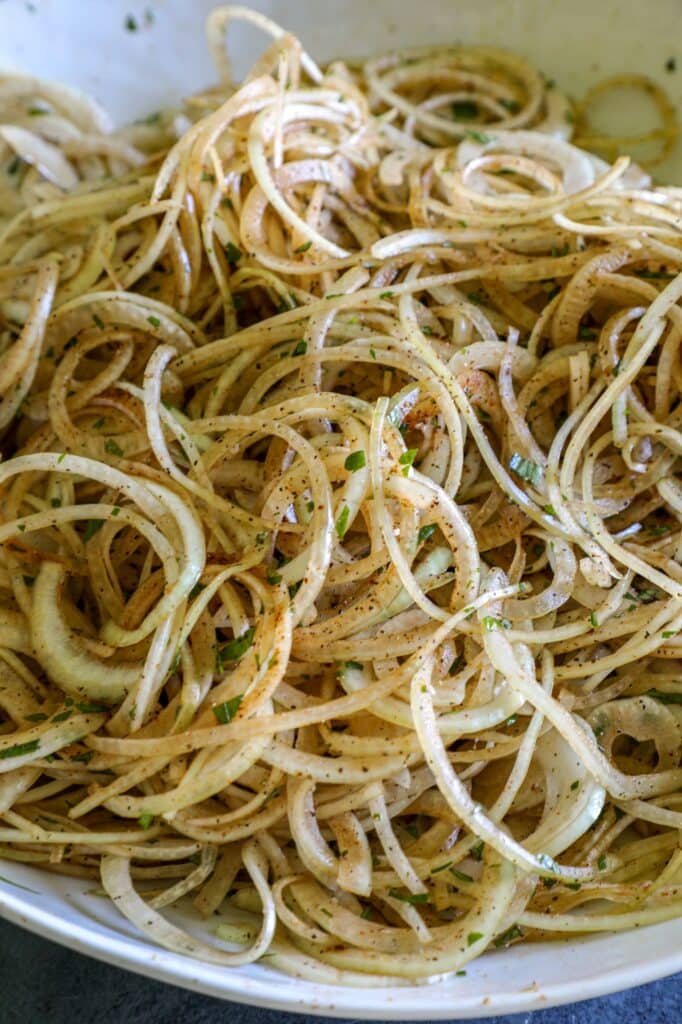 season the onions and toss to combine